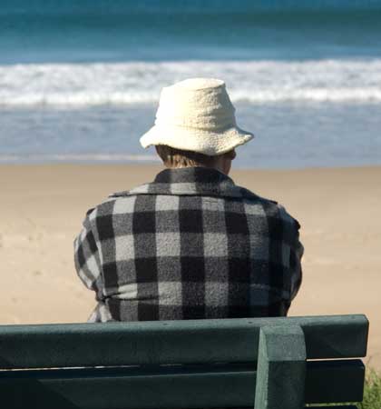 Person relaxing on the beach with no legal problems